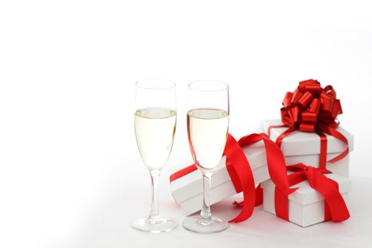 white gift with red ribbon