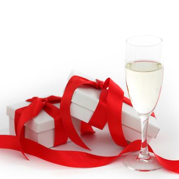 white gift with red ribbon