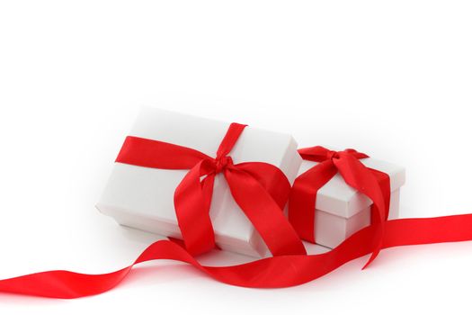 white gift with red ribbon