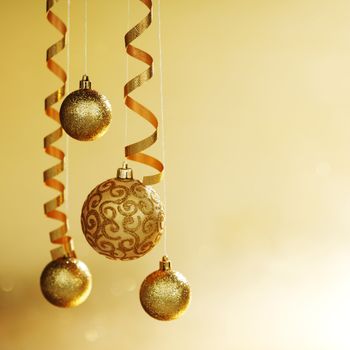 golden christmas balls on bokeh background