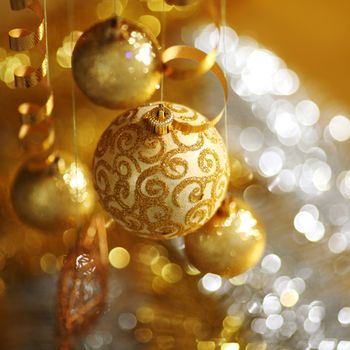 golden christmas balls on bokeh background