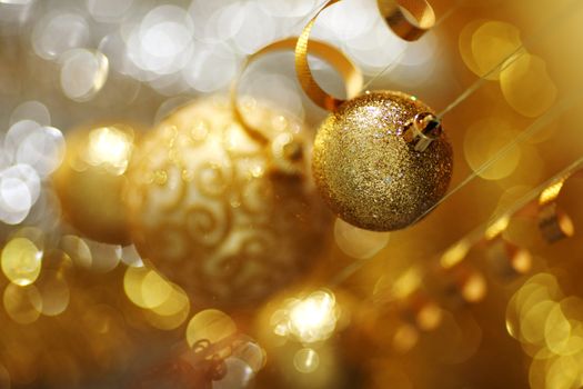 golden christmas balls on bokeh background