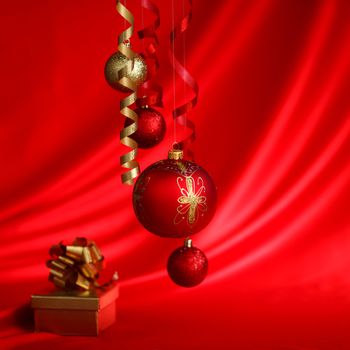  christmas balls on red satin background