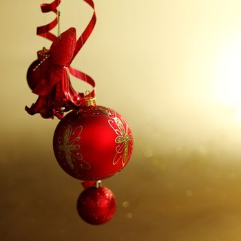  red christmas balls on gold  background