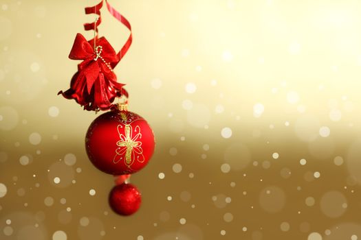  red christmas balls on gold  background
