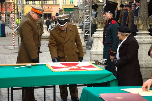 WROCLAW, POLAND - DECEMBER 2: Polish army, engineering training center for troops receives new army banner. Officer blesses new banner on December 2, 2011.