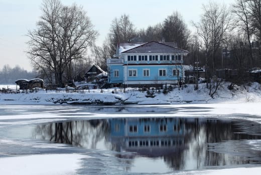 home on the bank of the Neva river the winter