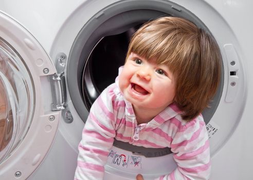 baby girl in the washing machine