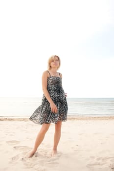 woman on the beach watching into the distance