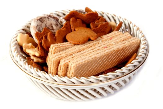 bowl with sweets on a white background