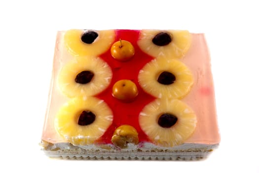 cake with jelly and fruits over white