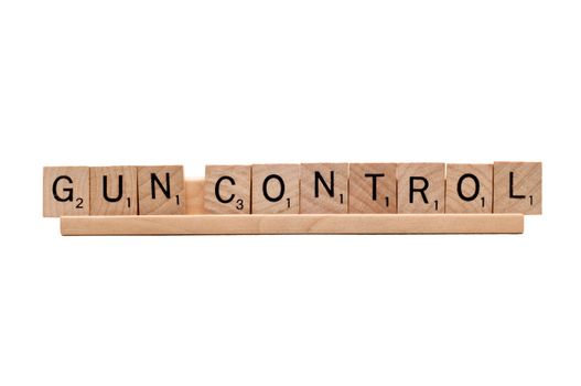 Gun Control spelled in Scrabble letters.  Isolated on white background