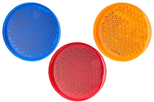 Red, blue, and yellow round reflectors isolated on white background.