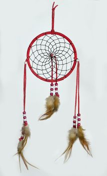 Simple, red, native american dreamcatcher isolated on white