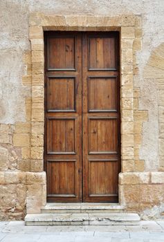 Vintage brown wooden door in Italy