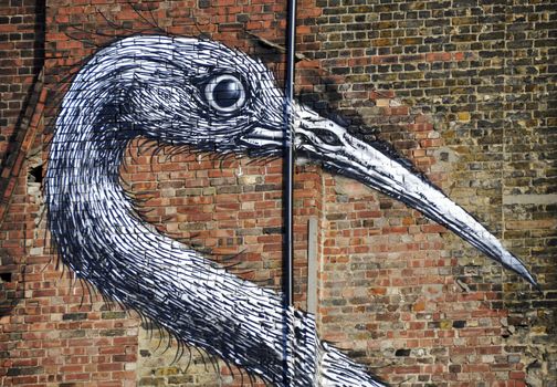 Bird graffiti on a brick wall in London