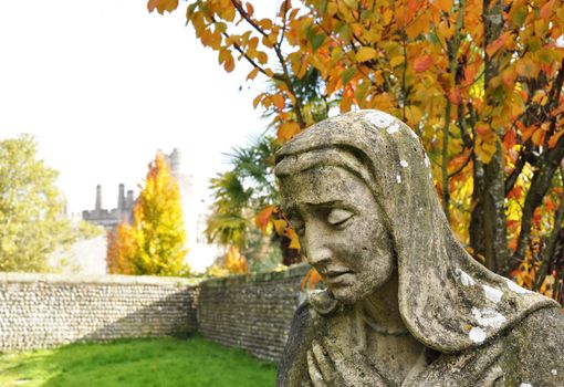 Virgin Mary statue in Arundel graveyard, England, UK