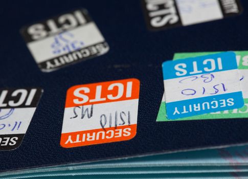 Stick on security stamps on back of passport