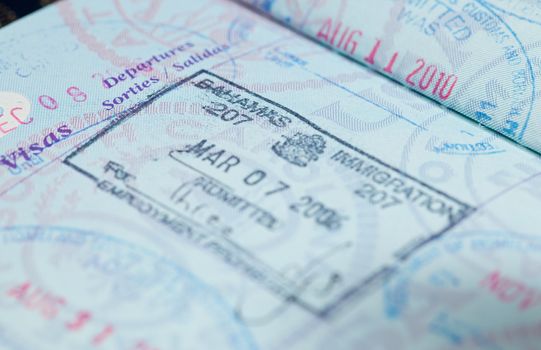 Macro image of visa and immigration stamps in US passport for Bahamas