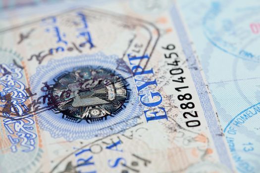 Macro image of visa and immigration stamps in US passport for Cairo Egypt