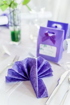 Wedding celebration table setting with purple decoration