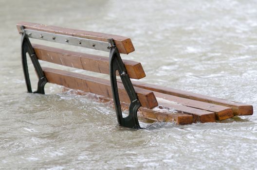 a bench surrounded by water