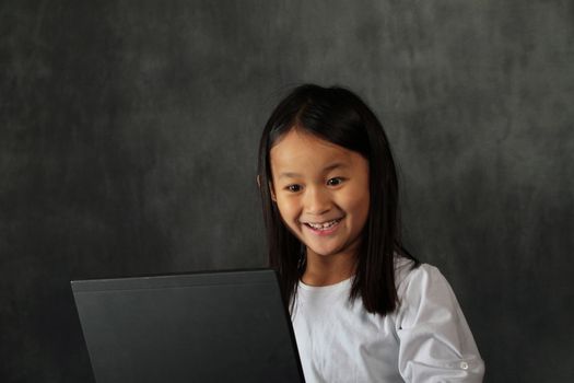 young child - girl- with computer keyboard
