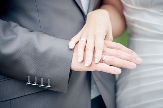 Bride and Groom showing their rings