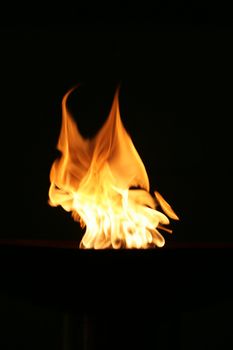 gas flame burning on a dark background