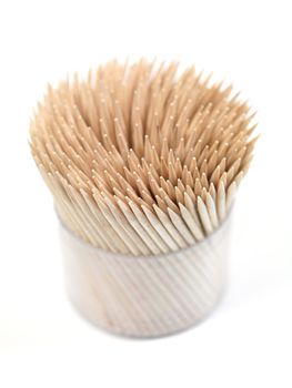 A close up shot of a wooden toothpicks on white