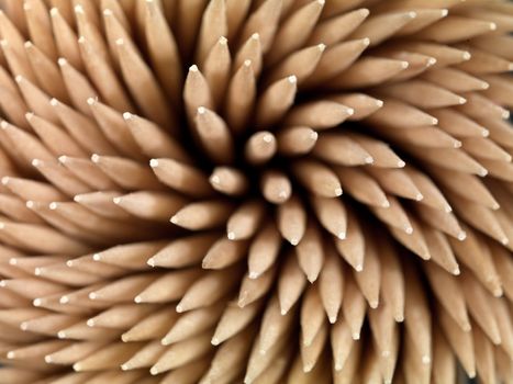 A close up shot of a wooden toothpicks on white