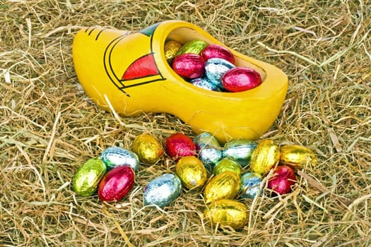 Traditional dutch wooden clog with little colored eggs