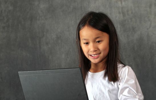 young child - girl- with computer keyboard