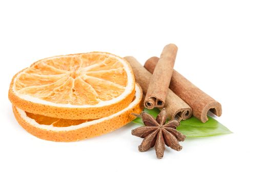 Star Anise, cinnamon and dried orange and green leave isolated on white background 