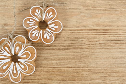 two gingerbread cookies on wooden background