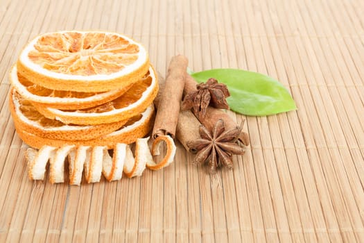 detail of Star Anise, cinnamon and dried orange  on wooden background 
