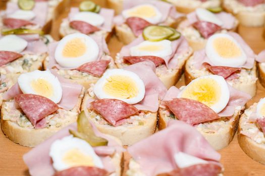 Detail of homemade sandwich with egg and sausage