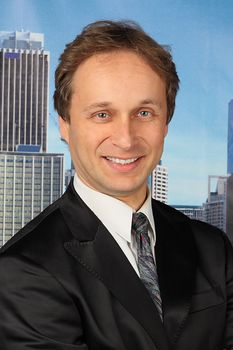portrait of middle age businessman in austere suit