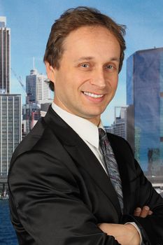 portrait of middle age businessman in austere suit