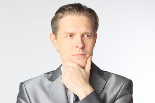 portrait of middle age businessman in austere suit