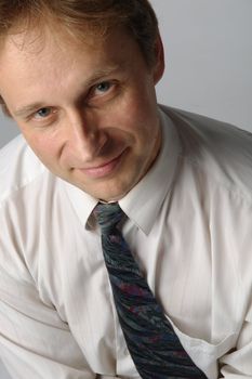 portrait of middle age businessman in austere suit