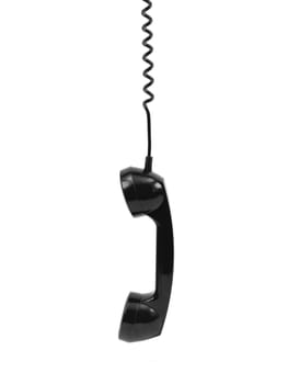 A rotary telephone hand set isolated against a white background