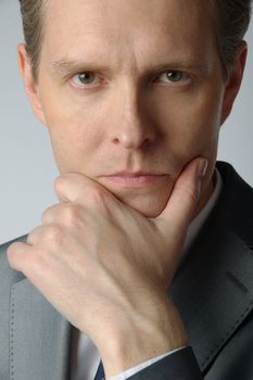 portrait of middle age businessman in austere suit