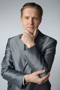 portrait of middle age businessman in austere suit