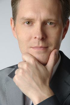 portrait of middle age businessman in austere suit