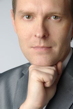portrait of middle age businessman in austere suit