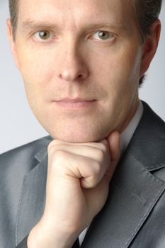 portrait of middle age businessman in austere suit