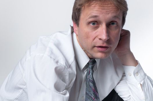 portrait of middle age businessman in austere suit