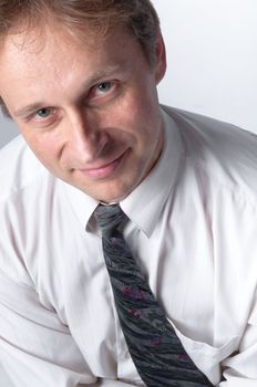 portrait of middle age businessman in austere suit