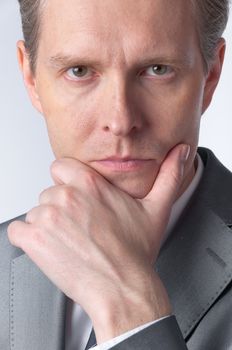 portrait of middle age businessman in austere suit